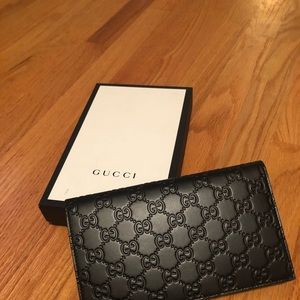 Black leather Gucci wallet or clutch